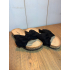 Black bow slippers